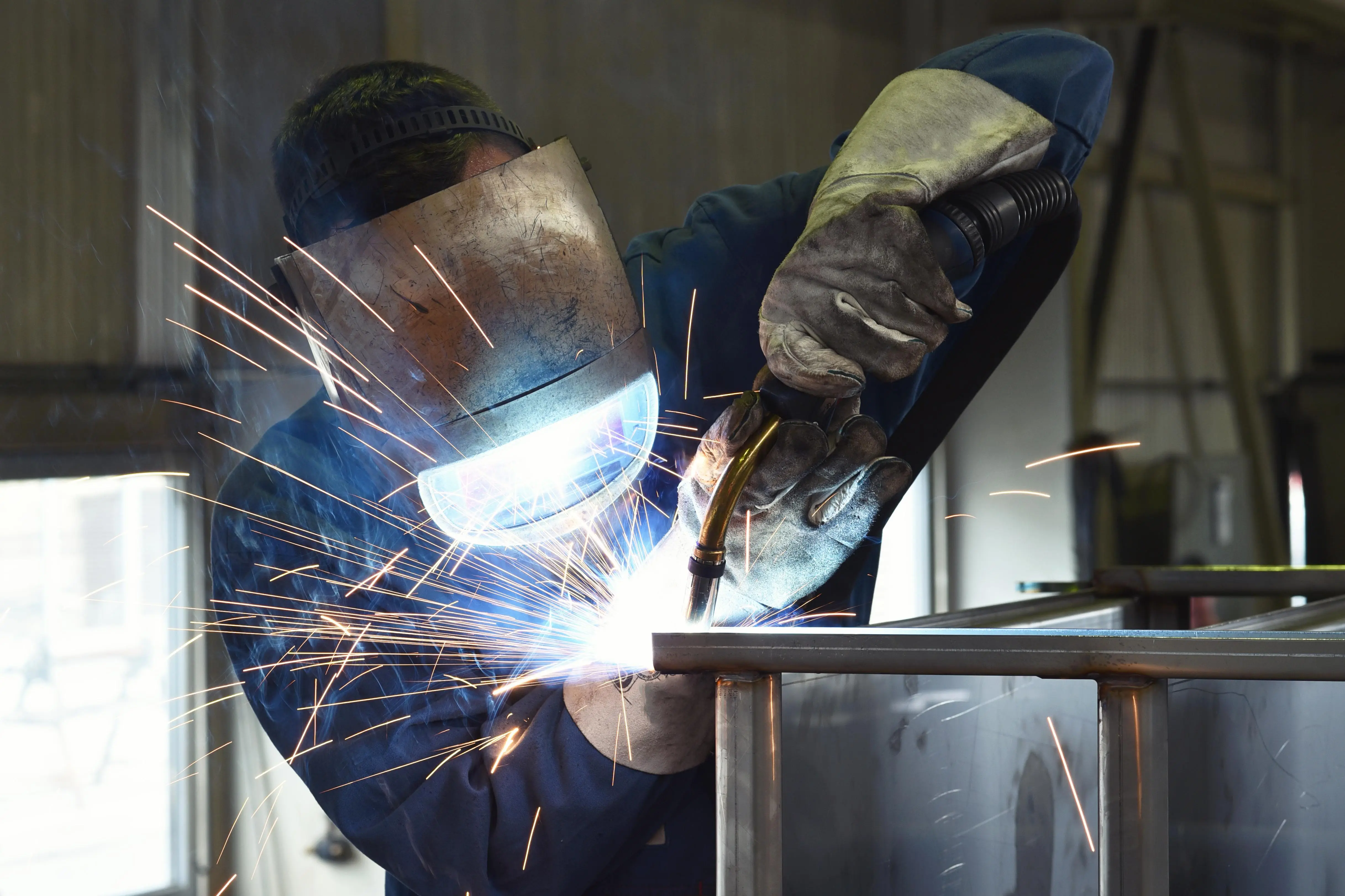 Welder working on a metal structure